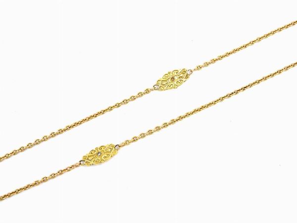 Long yellow gold necklace with diamonds