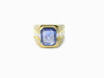Anello a Fascia in Oro Giallo con Diamanti e Zaffiro