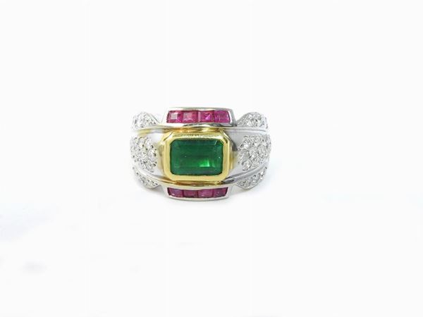 White and yellow gold band ring with diamonds, rubies and emerald