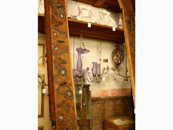 Large wooden lintel covered in Art Nouveau embossed leather