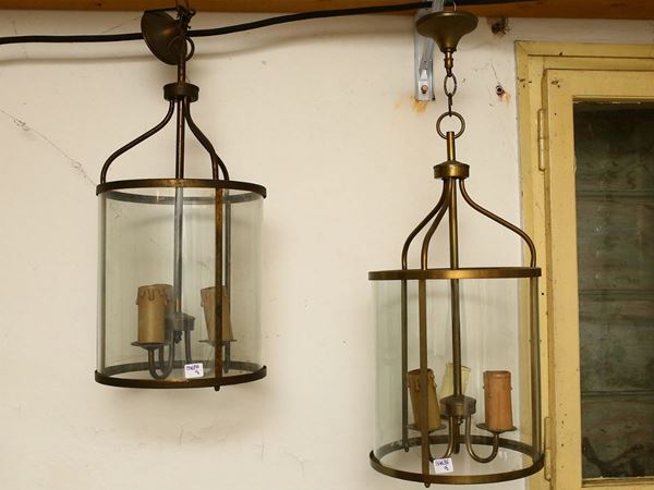 Pair of cylindrical lanterns in brass and glass