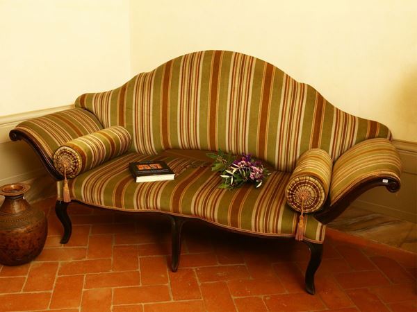 Fan-shaped sofa in walnut