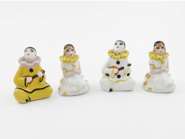 Series of four porcelain salt and pepper shakers