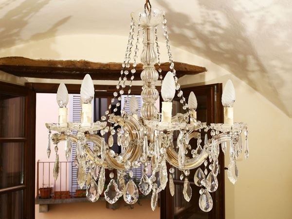 Chandelier in gilded metal and glass