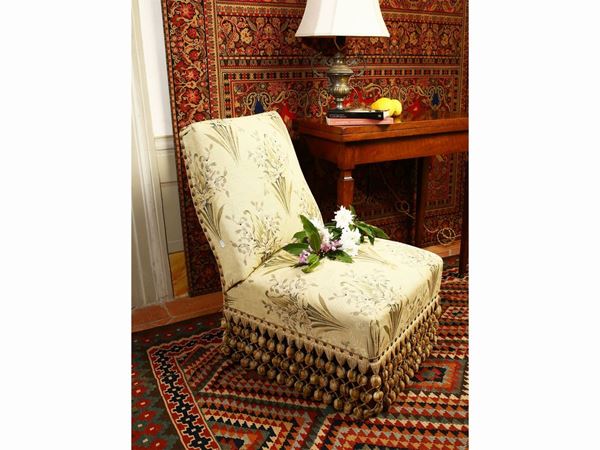 Pair of padded armchairs covered in floral fabric