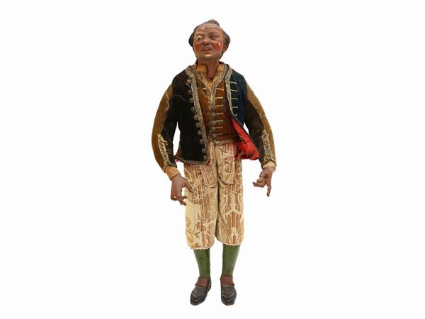 A wooden Nativity scene character