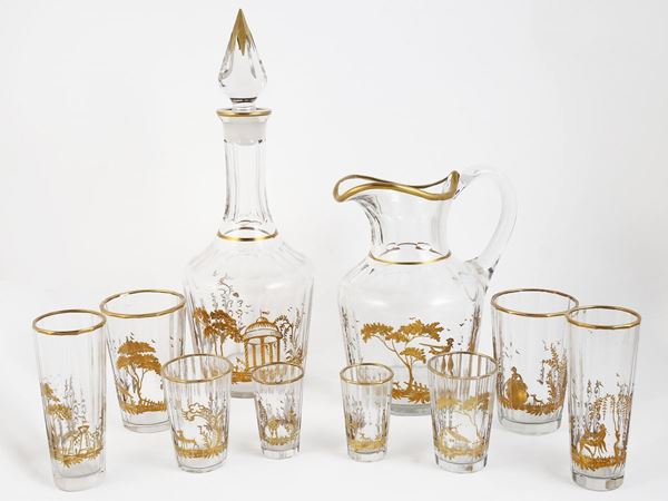 Servito di bicchieri in cristallo lumeggiati in oro