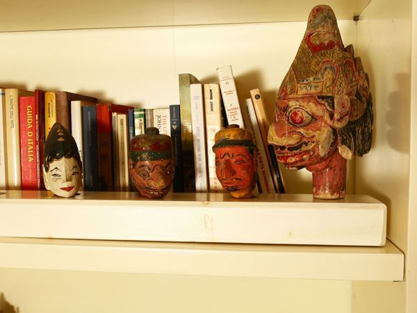 Five Thai puppet heads in carved and lacquered wood