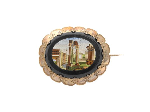 Low alloy gold brooch with micromosaic on onyx