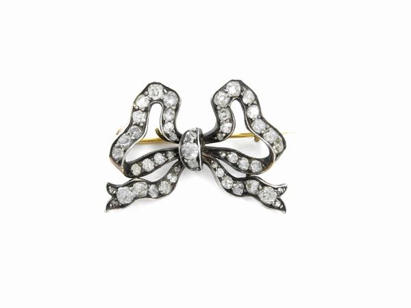 Yellow gold and silver brooch with diamonds