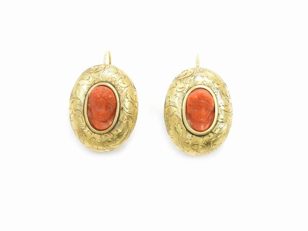 Yellow gold pendant earrings with orange red coral cameos