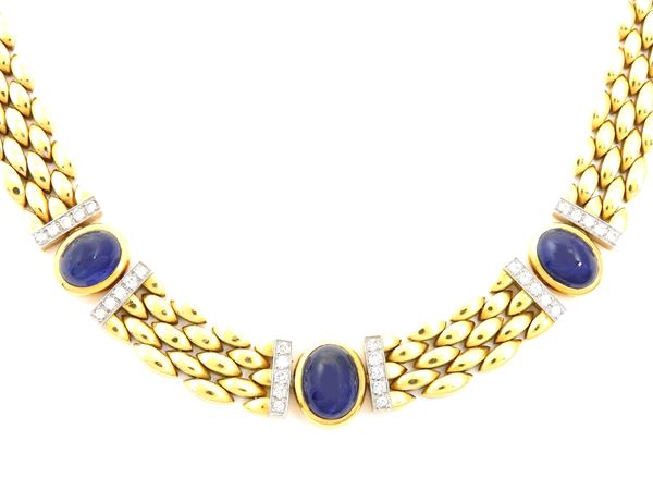 Yellow gold chocker with diamonds and sapphires