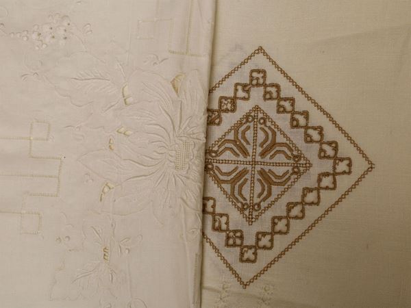 Two embroidered linen tablecloths