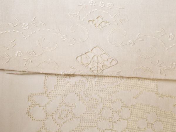 Two sets of double sheets in white linen