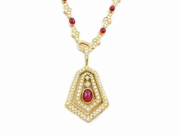 Yellow gold necklace and pendant with diamonds and rubies