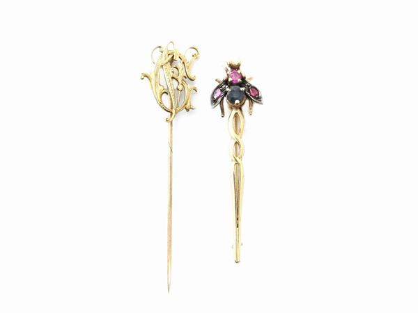 Two low alloy gold and silver brooches with rubies and sapphire