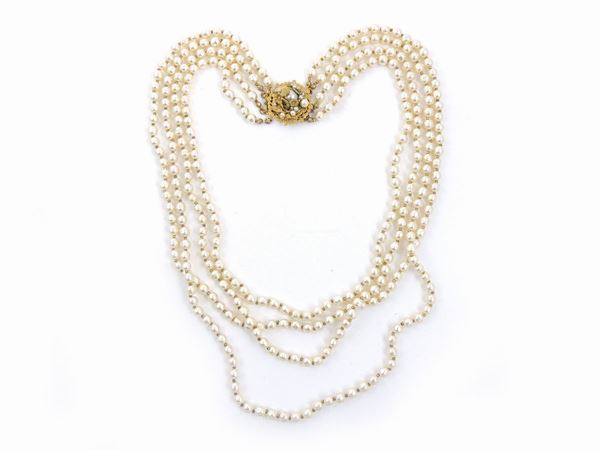 Multi-strand necklace in simulated baroque pearls and golden metal, Miriam Haskell