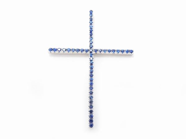 White gold cross pendant with sapphires