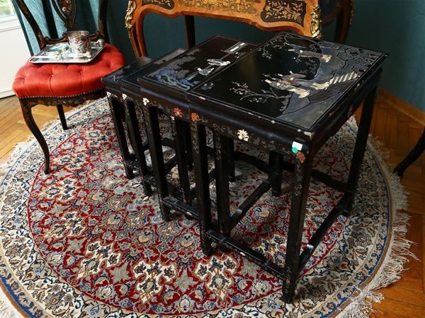 Nest of tables in black lacquer