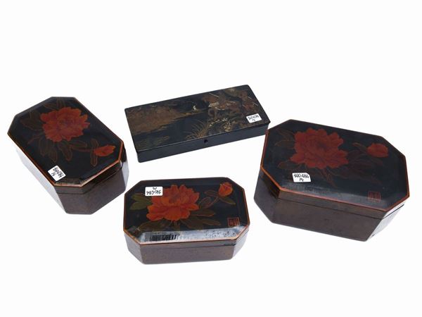 Four boxes in black lacquer