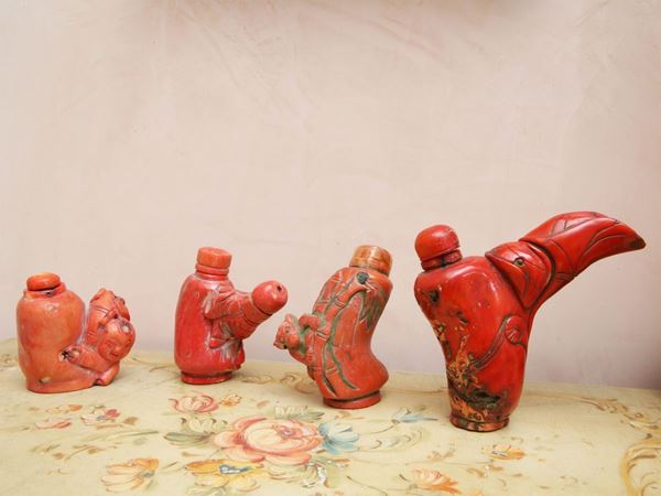 Four snuff-bottles in bamboo coral