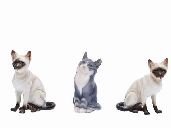 Three porcelain cats