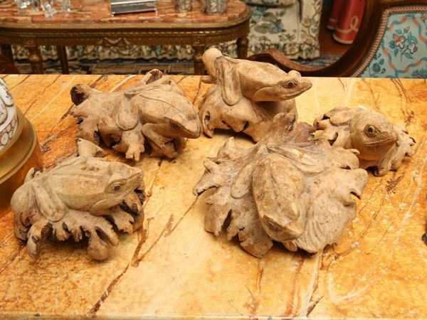 Five frogs made with carved wooden root fragments