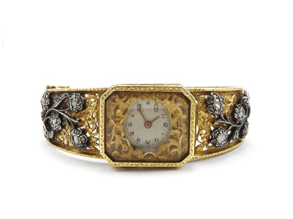 Yellow gold and silver bangle watch with diamonds
