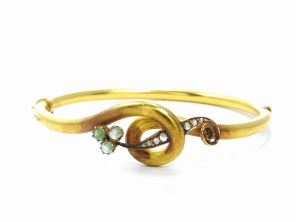 Low alloy yellow gold Bourbon bangle with diamonds and emeralds