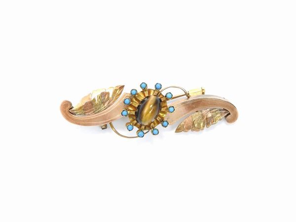 Low alloy pink and yellow gold Bourbon brooch with tiger eye quartz and blue glasses