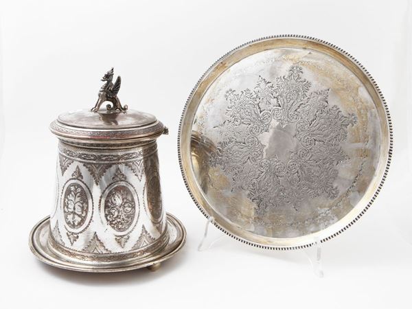 Two silver metal table accessories