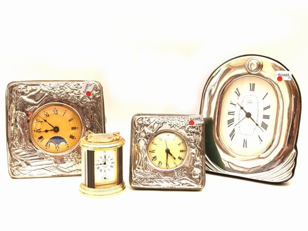 Three silver table clocks