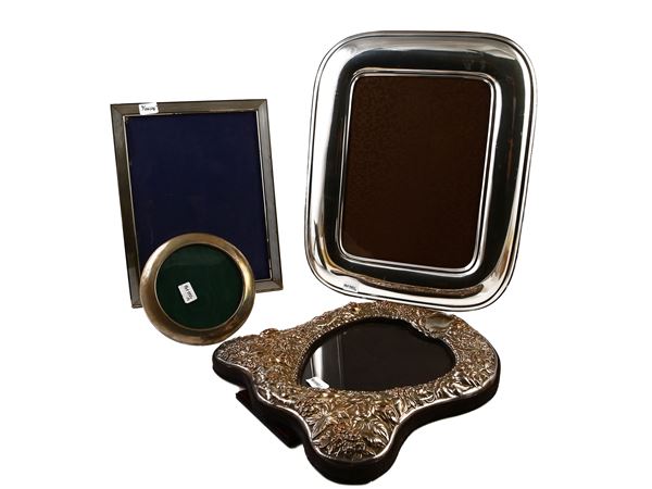 Four silver metal photo frames