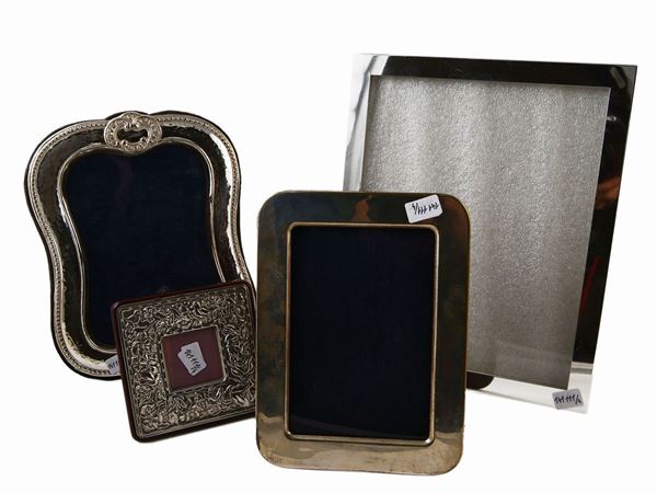 Four picture frames in silver metal
