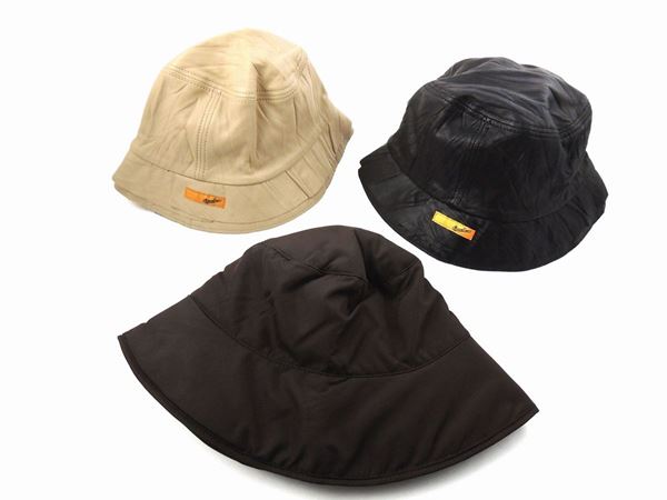 Three caps in leather and waterproof fabric