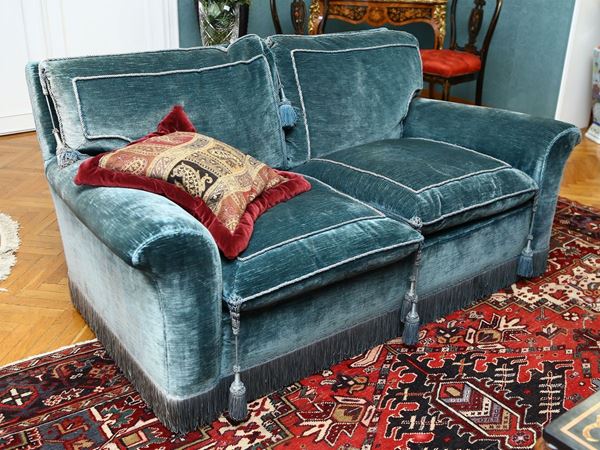 Upholstered two-seater sofa