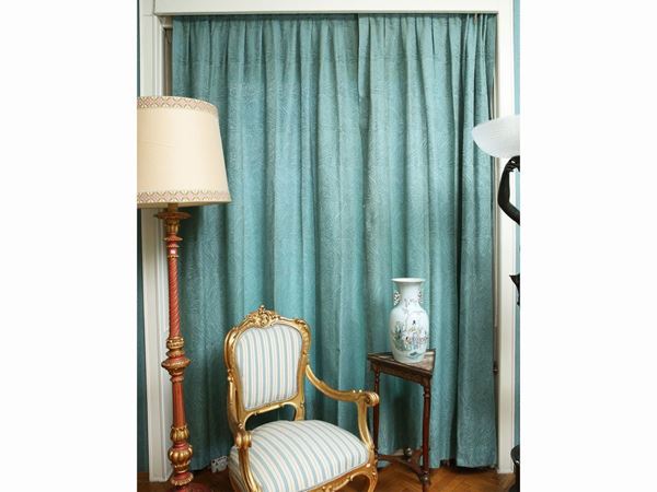 Lot of teal-colored damask curtains