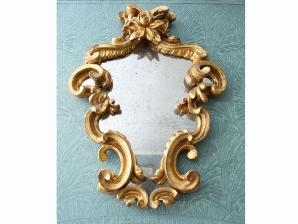 Small mirror in carved and gilded wood