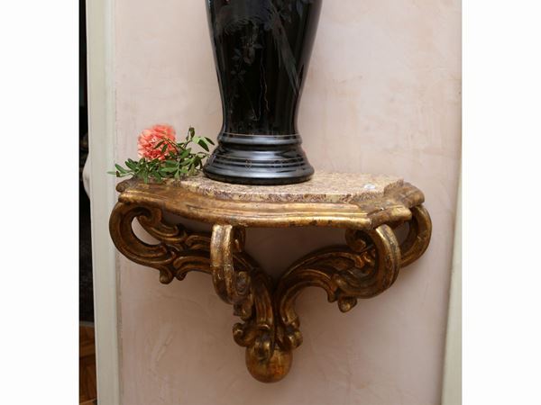 Small hanging console in carved and gilded wood