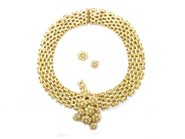 Yellow gold Spallanzani parure of divisible brooch-necklace and earrings with diamonds
