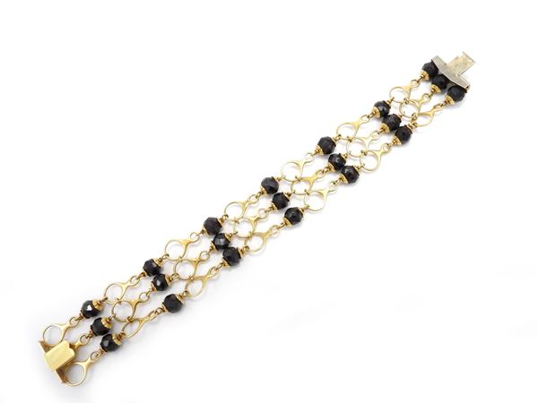 Yellow gold bracelet with garnets