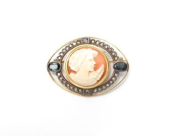 Yellow gold and silver brooch with diamonds, sapphires and shell cameo