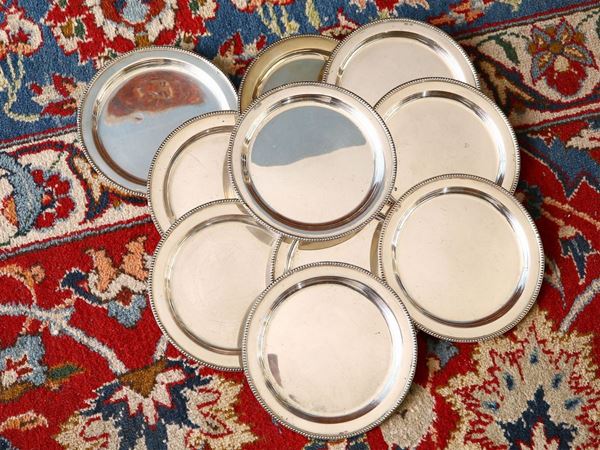 Serie di dieci piattini da pane in argento