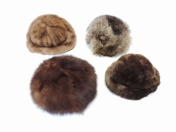 Four brown fur hats