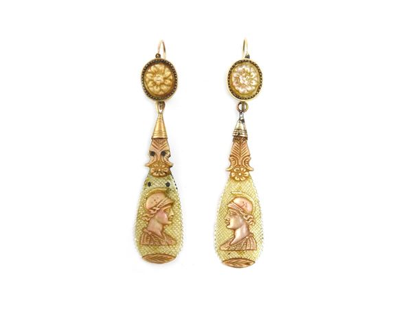 Low title gold pendant earrings with mother of pearl
