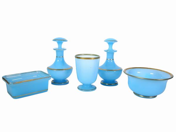 Light blue opaline toilet set highlighted in gold