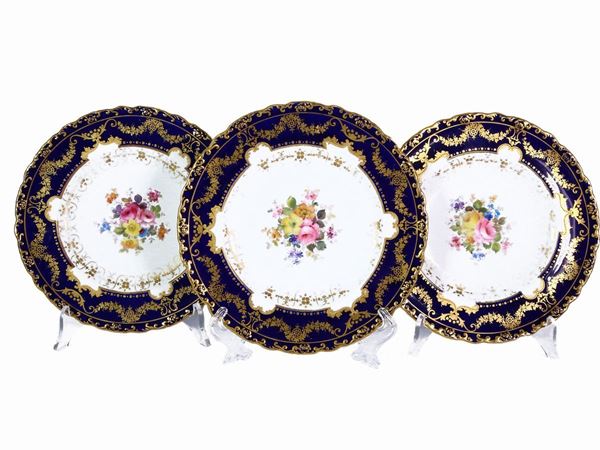 Set of eight saucers in polychrome porcelain, Royal Crown Derby