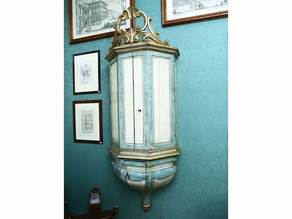 Hanging cabinet in lacquered wood in shades of light blue and ivory