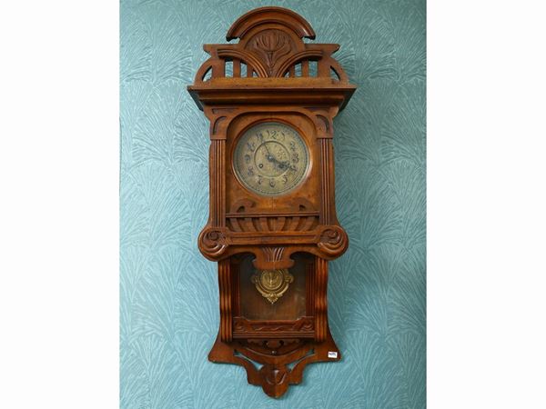 Wall pendulum clock in soft wood