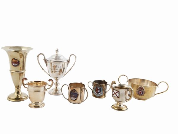 Collection of small trophies in silver-plated metal and enamels